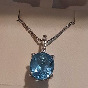 Sterling Silver Geniune blue topaz diamond accent oval pendant